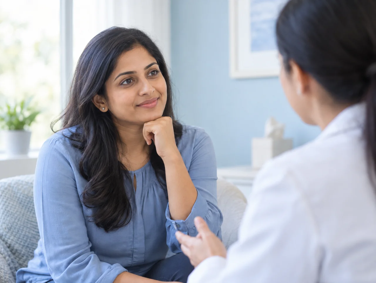 A woman having a supportive conversation with a healthcare professional